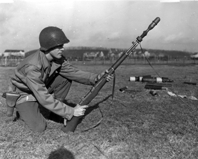 US soldier demonstrating how to fire a rifle grenade with M1 Garand.