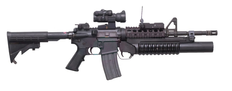 M4 with M203 mounted on white background.