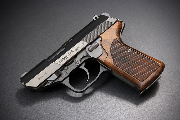 P5 pistol on grey background.