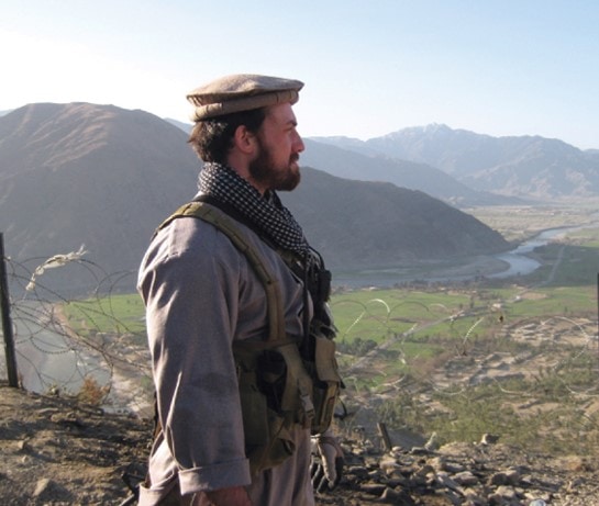 CIA PMOO wearing local Afghan clothes with combat gear.