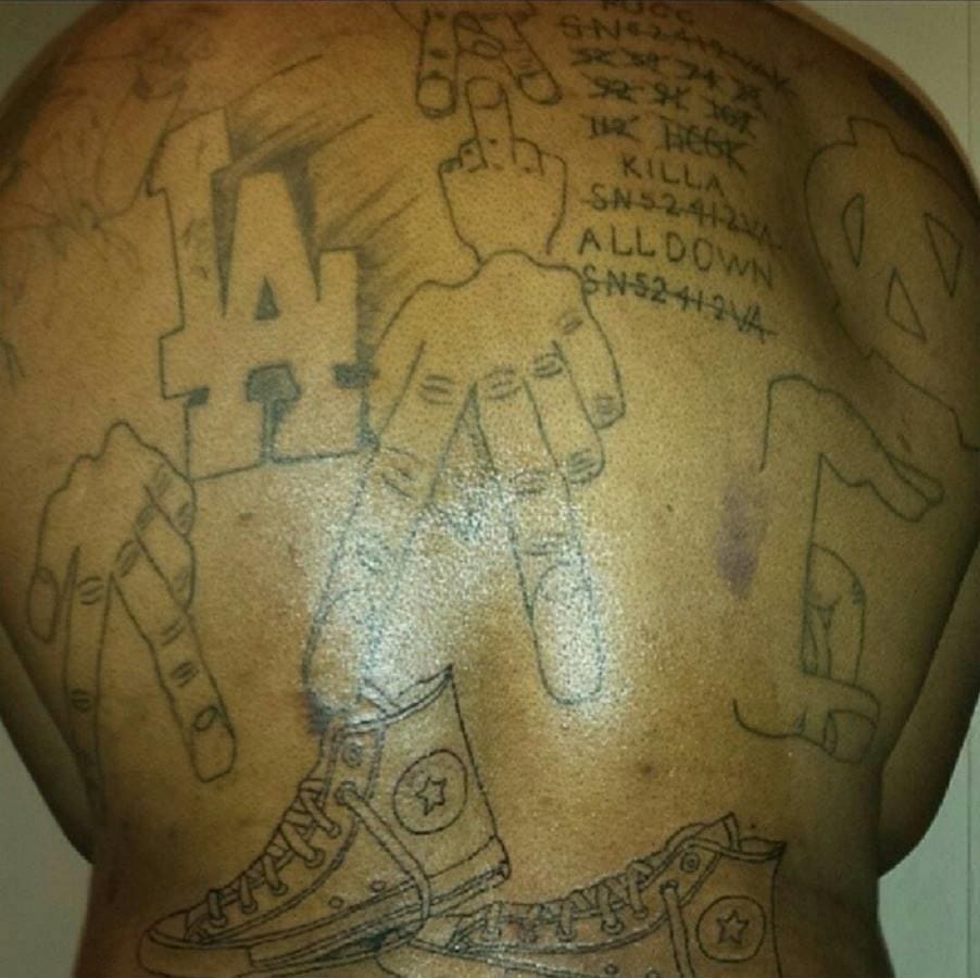 A back tattoo on the member of an Los Angeles street gang