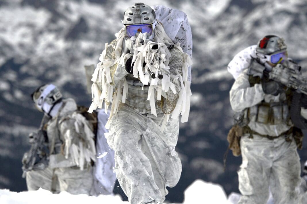 Navy SEAL's from the Naval Special Warfare Community demonstrate winter warfare capabilities for a TV commercial produced by the Navy Recruiting Command for a national advertising campaign shot at Mammoth Lakes, Calif., on Dec 9, 2014.