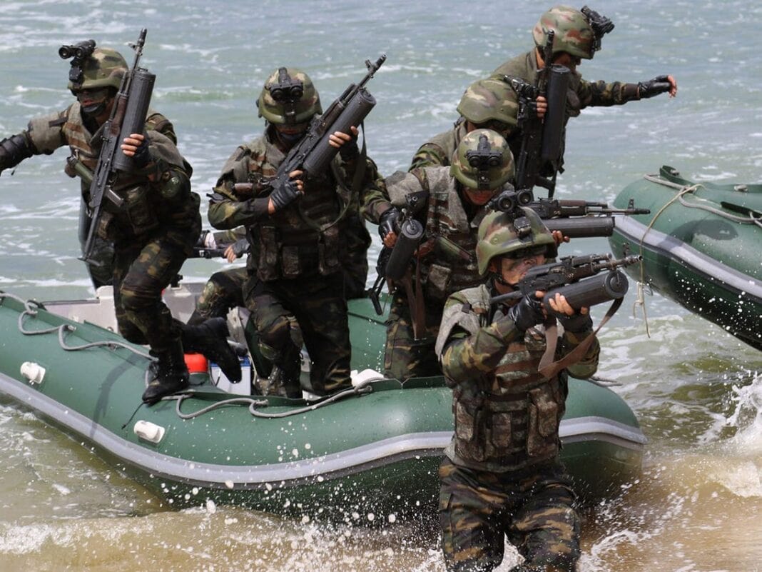 North Korean Special Forces participating in a simulated beach assault. These are most likely members of the Navy sniper brigades.