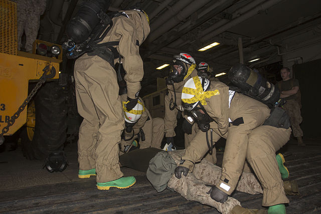 Chemical, biological, radiological and nuclear defense specialist U.S. Marines assigned to the 26th Marine Expeditionary Unit (MEU), assess a simulated casualty