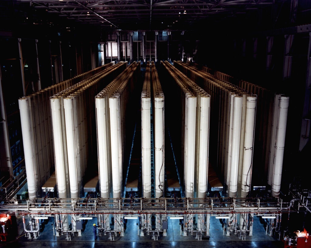 Centrifuge machines at the gas centrifuge enrichment plant in Piketon, Ohio. Similar machines were operated at Natanz, and require extensive maintenance, typically carried out by computers. The Stuxnet attack ruined dozens of centrifuges, costing Iran millions of dollars and years of progress towards a nuclear device. It also brought with it the concept of cyber arms control.