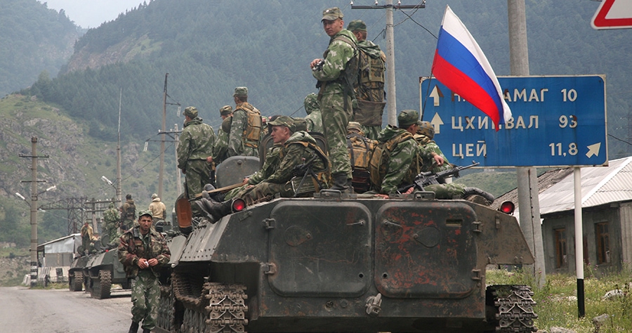 A column of Russian armoured vehicles move through North Ossetia towards the breakaway republic of South Ossetia's capital Tskhinvali. Cyberweapons were instrumental in Russia's victory during the conflict, and further the need for cyber arms control.