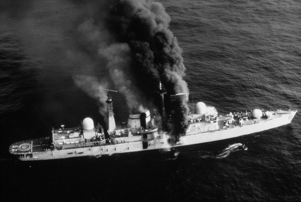 The HMS Sheffield after suffering an Exocet missile strike. The inability/failure of the ship to properly conduct electronic support resulted in 46 casualties, including 20 dead.