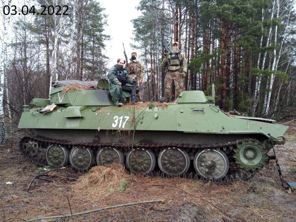 Ukrainian forces pose with a captured SNAR-10M1 battlefield surveillance radar. The inability to provide adequate EP and the faltering offensive caused Russian forces to abandon this vehicle, as it would be useless with sophisticated Russian electronic attacks against radar in the area of operation. 