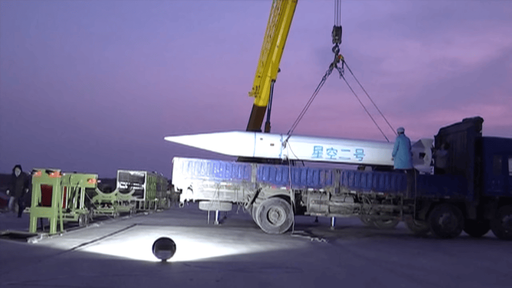 A reported sighting of the Xingkong-2, loaded into its rocket delivery vehicle. In this photo, it is being transferred to a mobile launcher, seen on the left of the image. (https://youtu.be/zVXswjrRPyA) china hypersonic
