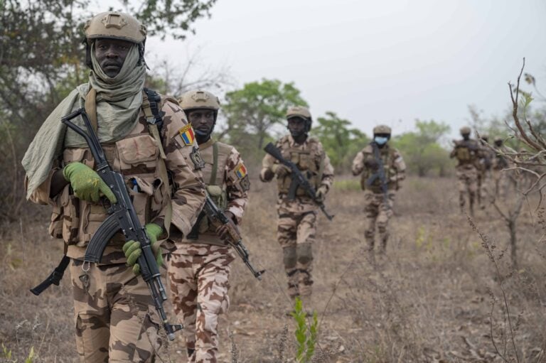 Members with the Chad National Army walk in formation while conducting patrols during Flintlock in Daboya, Ghana, March 7, 2023.