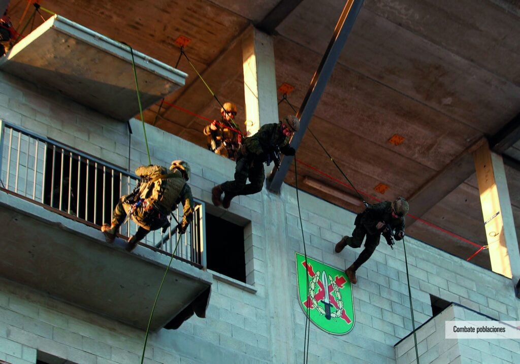 GOE operatives abseiling down a building.