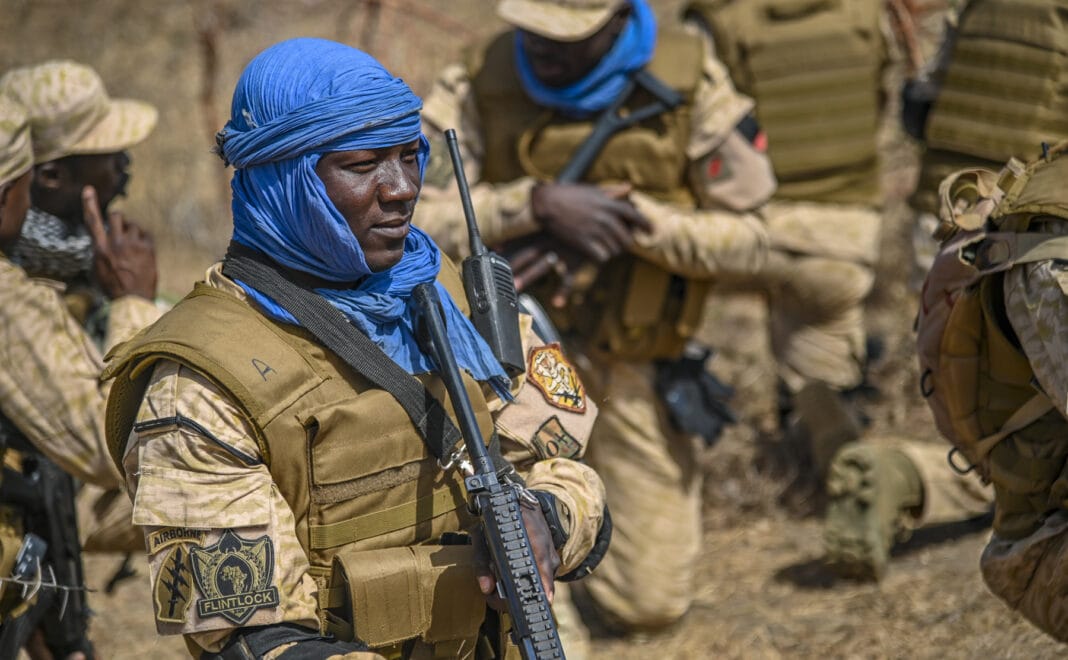 A Burkina Faso Soldier prepares to simulate conducting a patrol