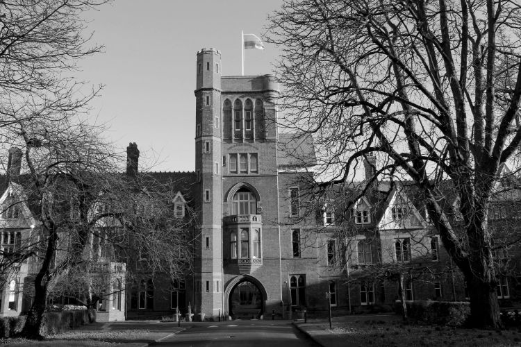 Image shows a black and white picture of a building at Cambridge University 