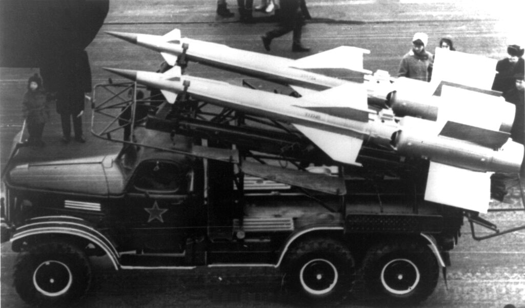A pair of S-125 missiles on a flat bed truck, black and white photo, early 1960's.