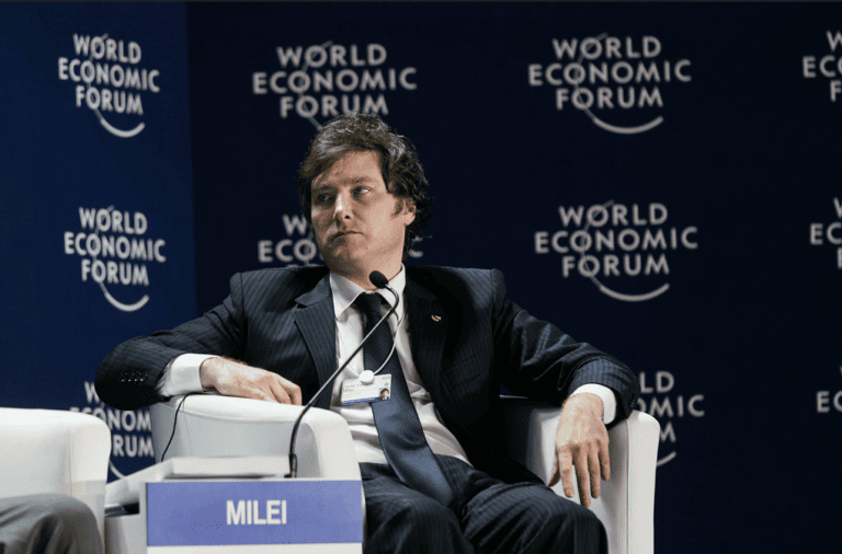 Argentinian Presidential candidate Javier Milei sitting during a conference for the World Economic Forum.