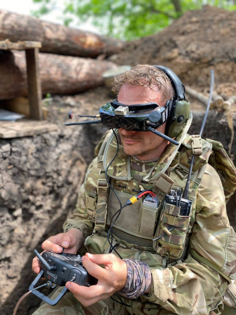 Adam Tactical Group combatant operating an FPV drone at the frontline