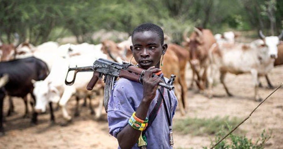 A Fulani Herdsman photographed with an AK pattern rifle.