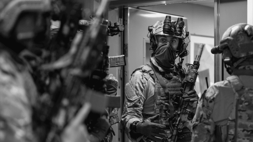 Operators from the United Kingdom Special Forces regroup following an assault on an oil rig during exercise Night Hawk 21 on October 6 2021.