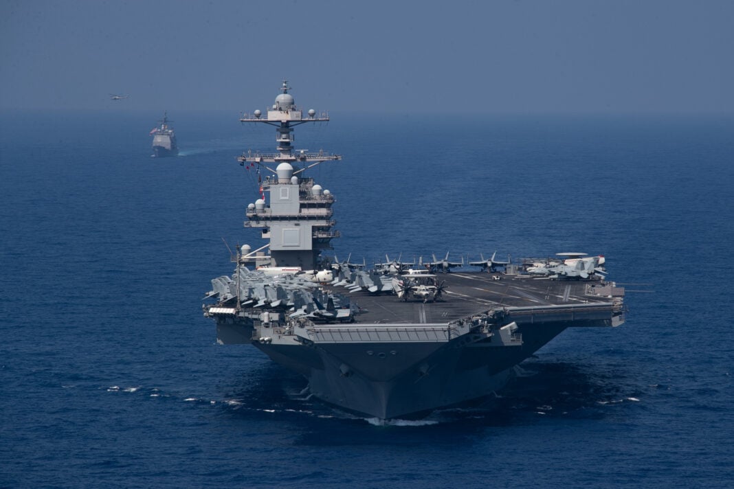 The world's largest aircraft carrier USS Gerald R. Ford (CVN 78) and the Ticonderoga-class guided-missile cruiser USS Normandy (CG 60) steam in formation in the Mediterranean Sea, Aug. 21, 2023.