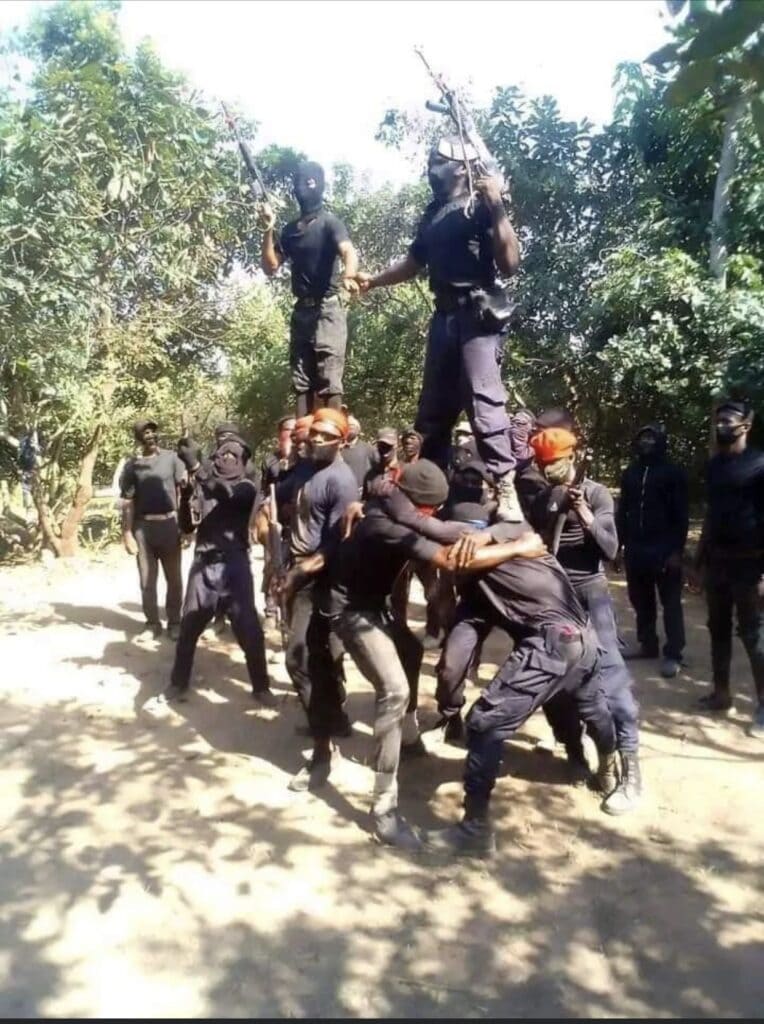 A group of IPOB-ESN soldiers standing on top of each other.
