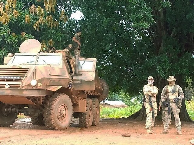 An image of Russian Wagner mercenaries which will likely transition to the Africa Corps in the future posing next to an armoured vehicle