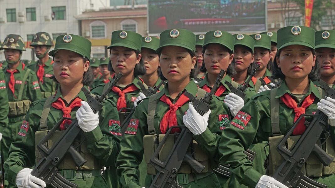 UWSA female soldiers stand at attention during a ceremony