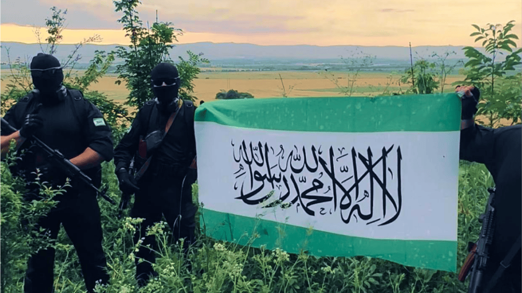 Ingush fighters holding the flag of the Ingush Liberation Army (ILA)