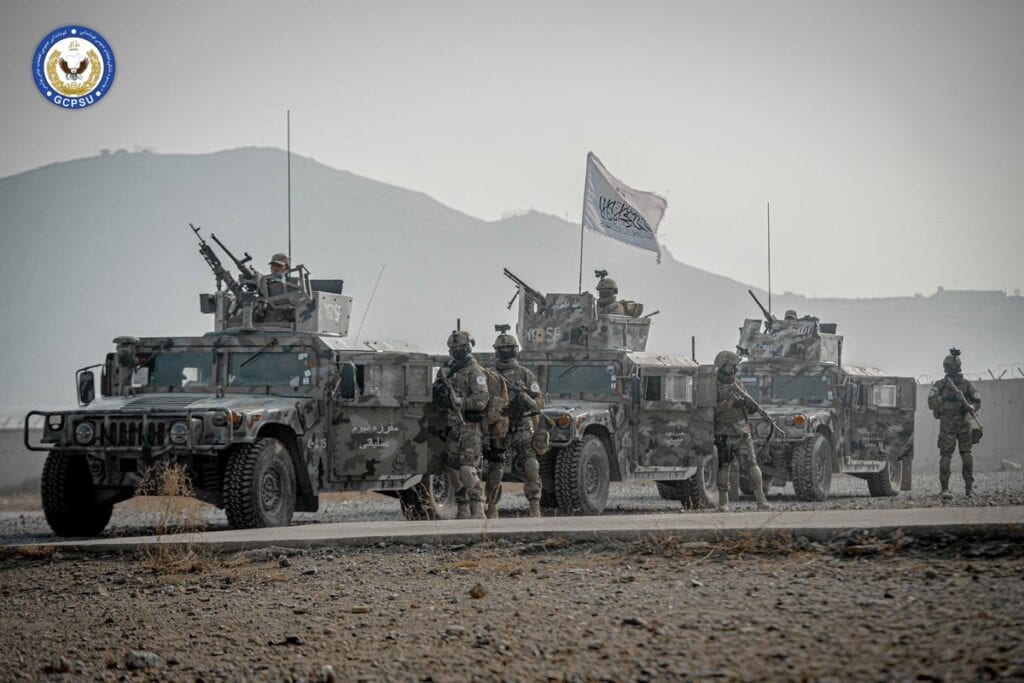 Operators with a convoy of Humvee's.