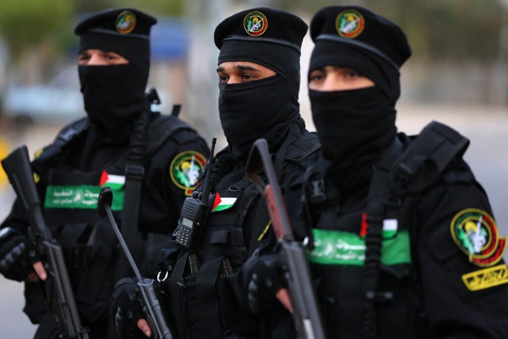 IQB fighters with Palestinian flag patch and the IQB emblem patch.
