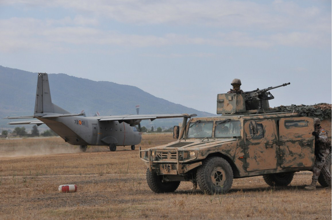 EZAPAC operatives protecting a C-212 Aviocar in a VAMTAC. 